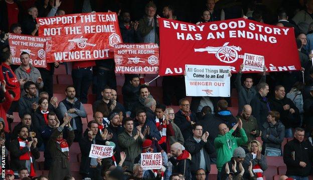 Fans inside the Emirates Stadium protesting against Wenger