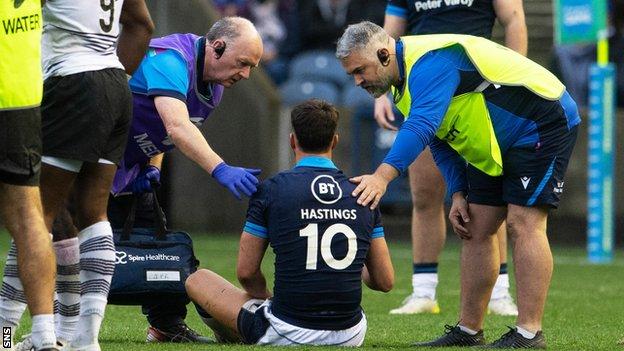 Scotland's Adam Hastings goes down injured against Fiji