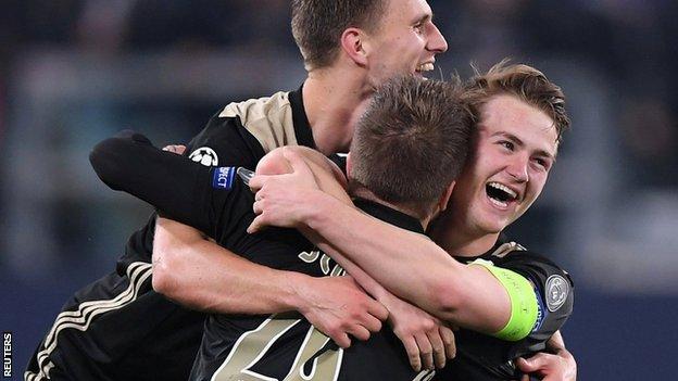 Ajax players celebrate their victory over Juventus