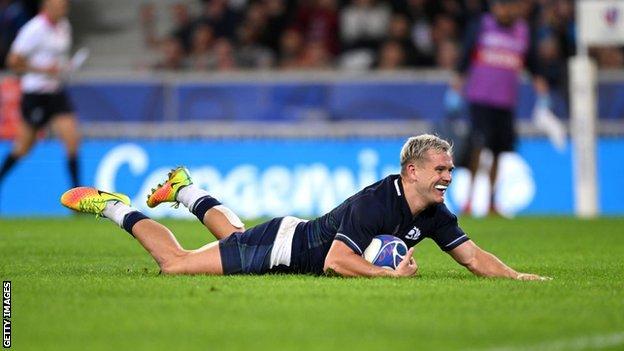 Darcy Graham smiles after he scores his fourth against Romania