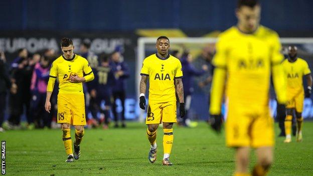 Tottenham players trudge off as Dinamo Zagreb players celebrate behind them