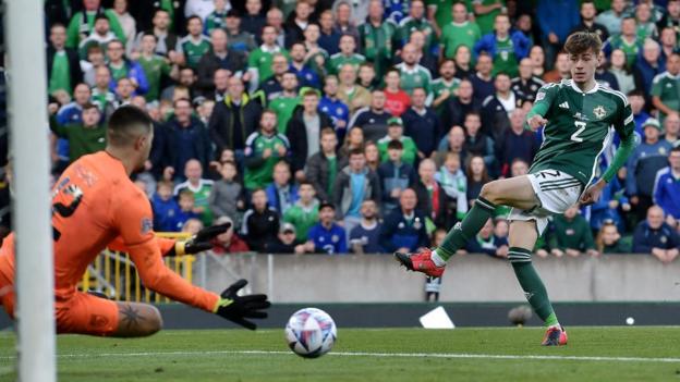 Conor Bradley sends in a shot for Northern Ireland in the Nations Cup game against Kosovo at Windsor Park last September