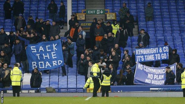 Some fans stayed behind to wave banners at Goodison Park