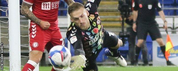 Bristol City goalkeeper Daniel Bentley makes a save