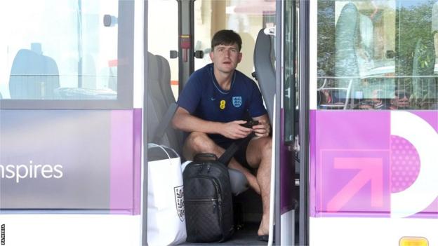 Harry Maguire sits on a bus