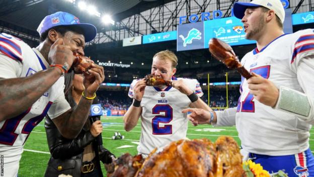 Stefon Diggs, Tyler Bass and Josh Allen eat turkey after the Buffalo Bills' Thanksgiving win at the Detroit Lions