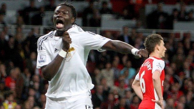 Bafetimbi Gomis celebrates scoring for Swansea against Arsenal