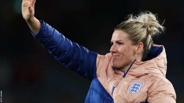 Millie Bright waves to the crowd after victory over Colombia