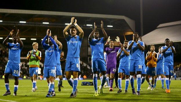 Wolves players celebrate victory at Fulham - their first away win since the first day of the season at Blackburn