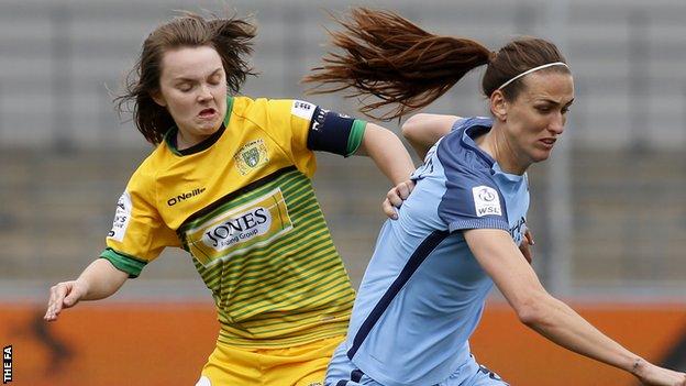 Ellie Curson challenges Manchester City's Jill Scott for the ball