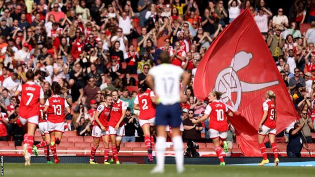 Arsenal celebrate after scoring against Tottenham