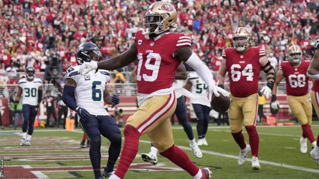 San Francisco 49ers wide receiver Deebo Samuel runs into the end zone