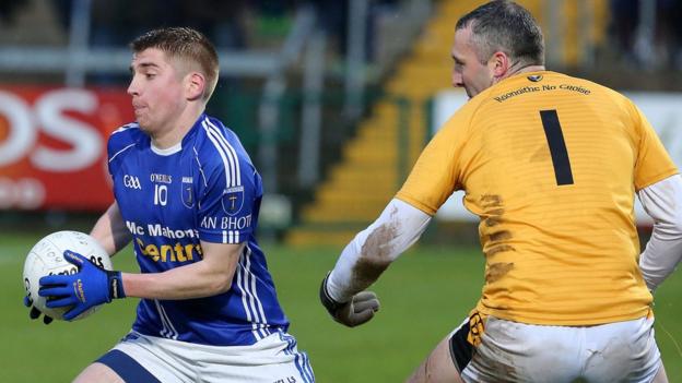 Scotstown forward Orin Heaphy attempts to evade Crossmaglen goalkeeper Paul Hearty in the Senior final at the Athletic Grounds