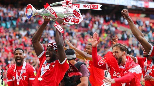 Nottingham Forest players celebrate with the play-off final trophy at Wembley