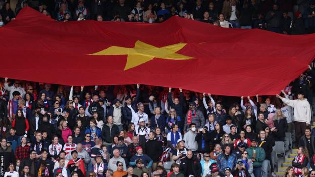 Vietnam fans show their support during their country's first match at a men's or women's Fifa World Cup