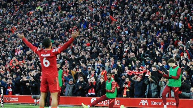 Thiago Alcantara celebrates with Anfield crowd