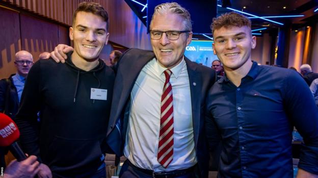 Burns celebrates his presidency win with his sons, Jarlath Og and Conall