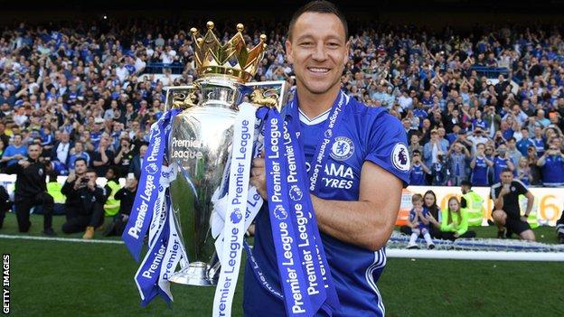 John Terry lifts the Premier League trophy