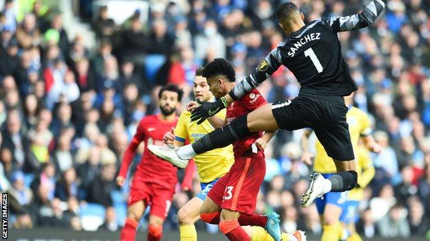 Robert Sanchez collides with Liverpool goalscorer Luis Diaz