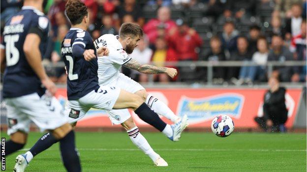 Millwall 1-2 Swansea: Ten-man Swans come from behind to stun hosts - BBC Sport