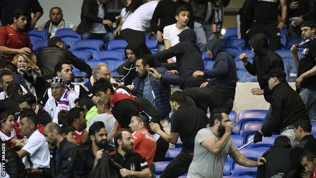 Violent scenes led to the Europa League fixture being delayed by 45 minutes