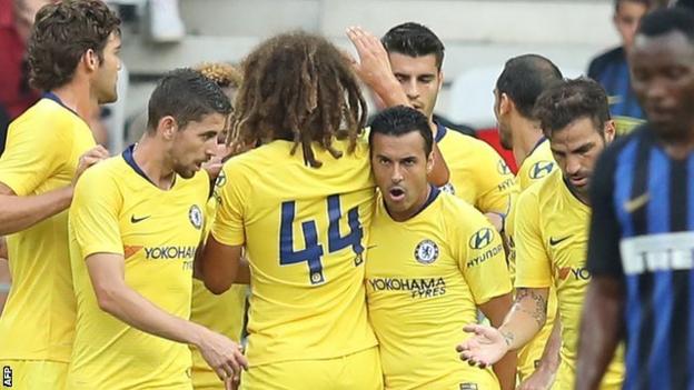 Chelsea celebrate scoring against AC Milan