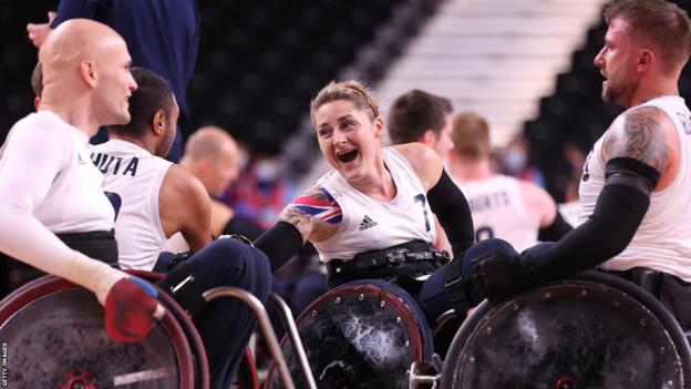GB's Kylie Grimes celebrates with her team-mates after winning Paralympic gold
