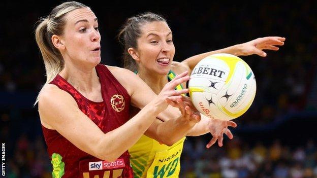 Natalie Metcalf of England and Amy Parmenter of Australia vie  for the ball