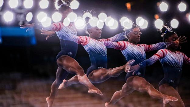 3 August: USA's Simone Biles captured using combined multiple exposures, warming up prior to the women's balance beam final on day 11 of the Tokyo Olympics