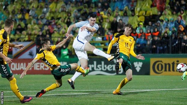 England defender Michael Keane takes a shot during his appearance against Lithuania