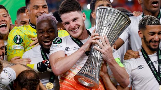 Declan Rice celebrates with the Europa Conference League trophy