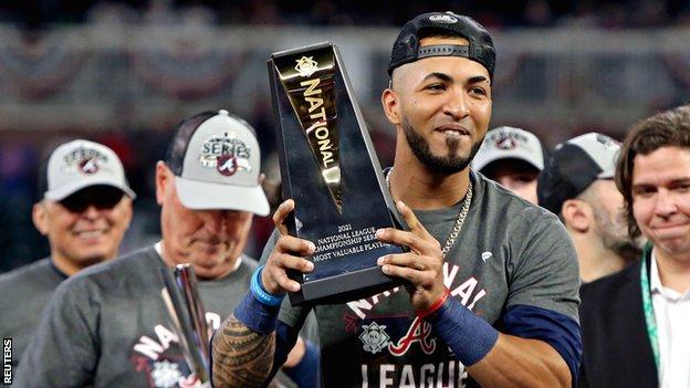 Atlanta Braves' Eddie Rosario holds the NLCS MVP trophy