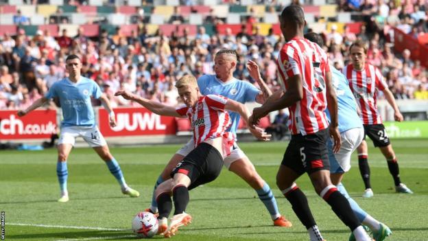 Ben Mee shoots at goal in Brentford's Premier League game at home to Manchester City