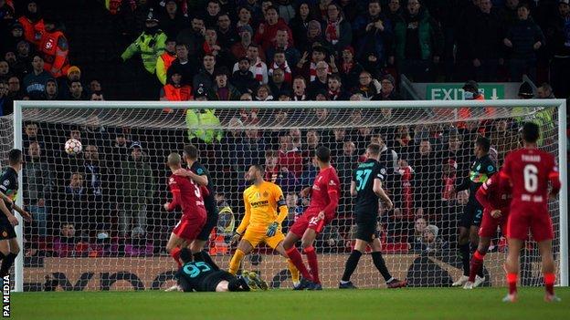 Liverpool defender Joel Matip sends a header against the bar during his side's Champions League match with Inter Milan