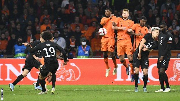 Germany's Leroy Sane shoots at goal from a free-kick against the Netherlands