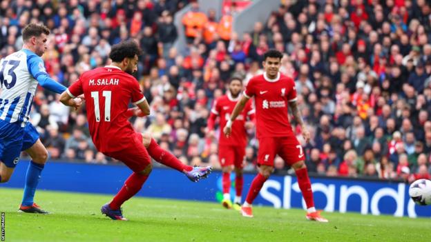 Mohamed Salah strokes in Liverpool's second goal against Brighton