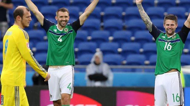Oliver Norwood (right) and Gareth McAuley celebrate after Northern Ireland's win over Ukraine at Euro 2016