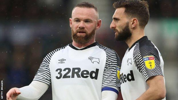 Shinnie, right, is happy to do all the "hard work" in midfield for team-mate Rooney
