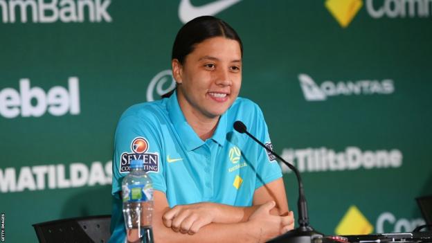 Sam Kerr smiles during a press conference