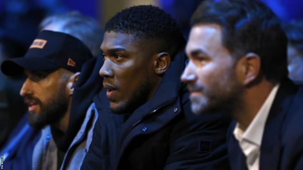 Anthony Joshua sits ringside with Eddie Hearn