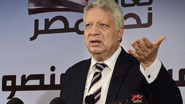 Mortada Mansour speaking at a press conference