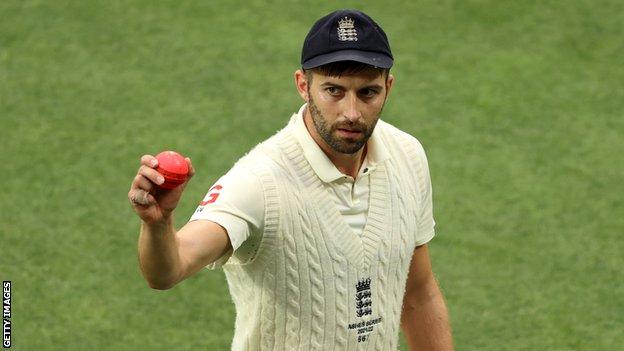 England bowler Mark Wood raises the ball to the crowd after taking five wickets in an innings against Australia