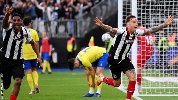 Jordan Maguire-Drew scores the winner for Grimsby in extra time