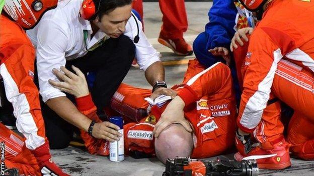 A Ferrari lies injured after a pit stop in 2018