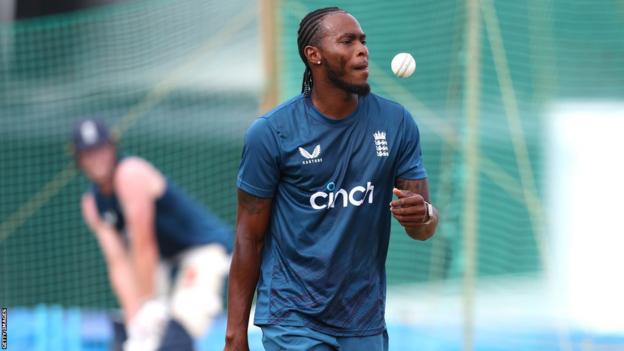 Jofra Archer tosses up a ball during a net session