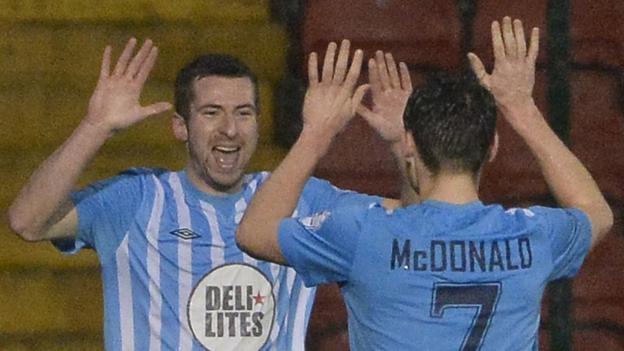 Stephen Murray celebrates with team-mate Conor McDoanld after scoring Warrenpoint's equaliser in the 1-1 draw away to Cliftonville