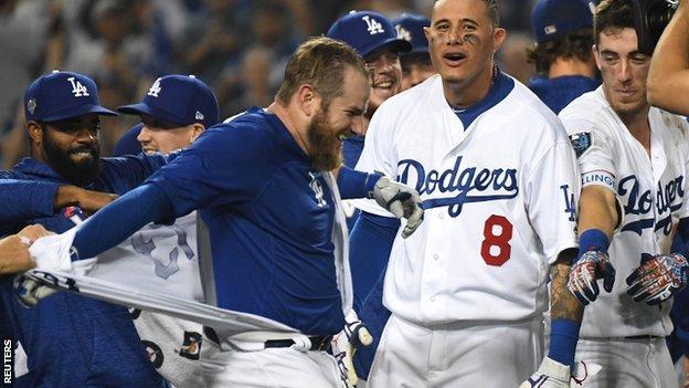 Max Muncy's walk-off home run led to him being mauled by team-mates, who ripped off his shirt in celebration