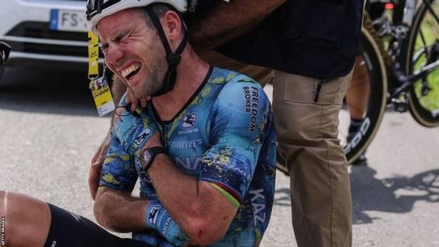 Mark Cavendish grimaces after a crash on stage eight of the 2023 Tour de France, which forced him to abandon the race