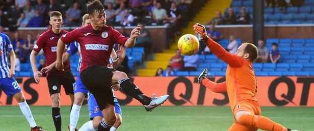 Jamie MacDonald blocks Danny Mullen's close-range shot