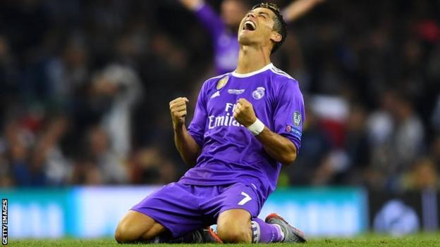 Real Madrid forward Cristiano Ronaldo celebrates as his two goals help Real Madrid beat Juventus 4-1 in the Champions League final